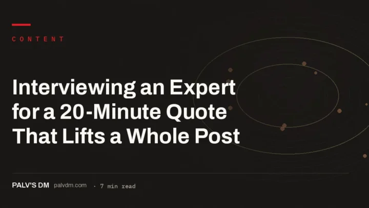 Minimal desk workspace with laptop and notebook representing an expert interview for content research