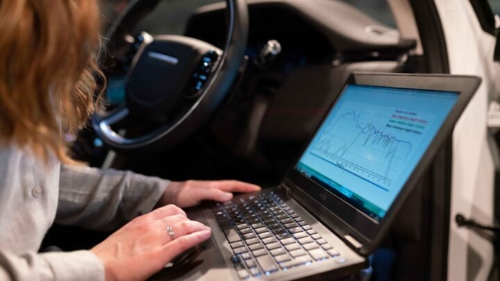 Marketer reviewing a competitor's organic traffic and keyword dashboard on a laptop screen