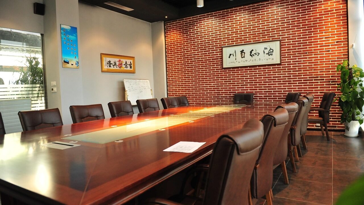 Business negotiation meeting room with an empty table and chairs