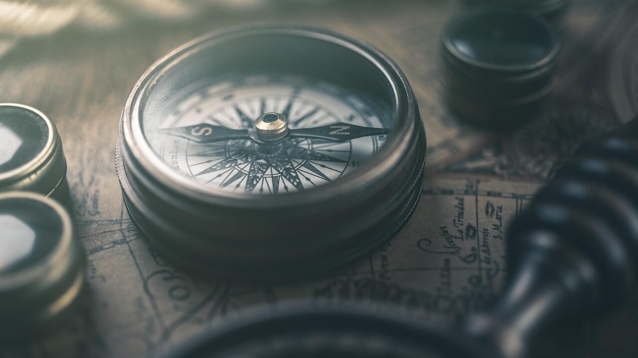 A compass on a map, representing a founder choosing a personal brand direction