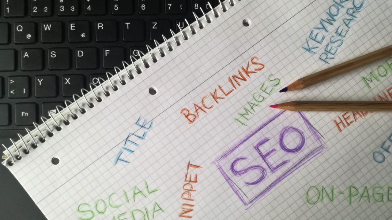 Marketer comparing free keyword research tools on a laptop
