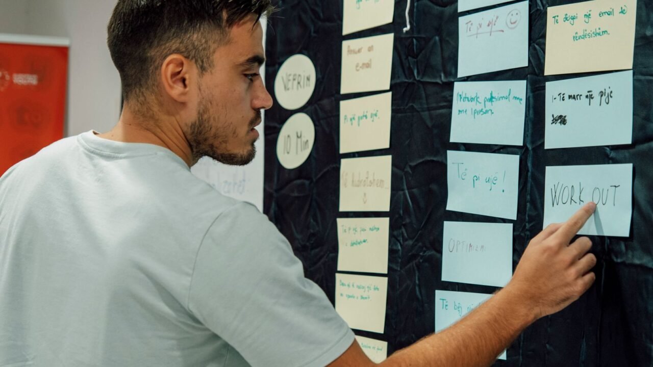Marketer mapping primary keywords to website pages on a spreadsheet