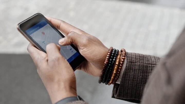 Business owner checking local search results and map listing on a smartphone