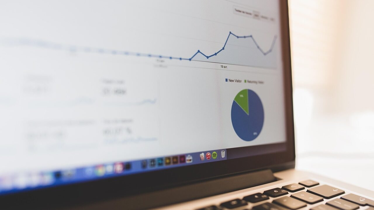 Growth chart displayed on a laptop screen during a business presentation, representing SEO performance tracking