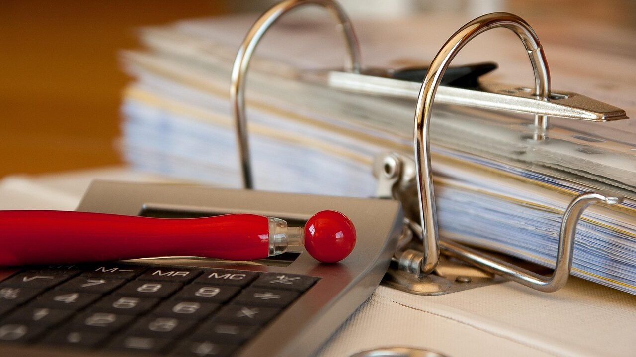 Filing cabinet with organised business documents, representing recovering account and access records from a former agency