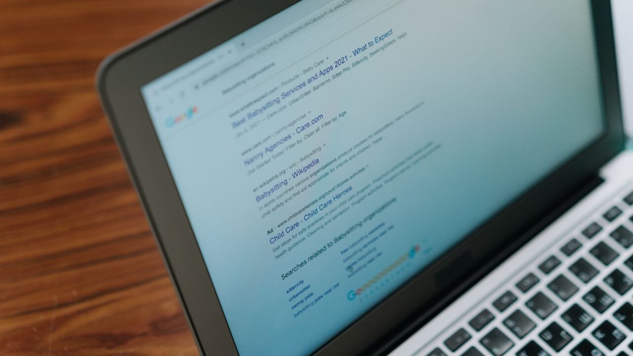 Person reviewing search engine results on a laptop screen, representing the four types of search intent