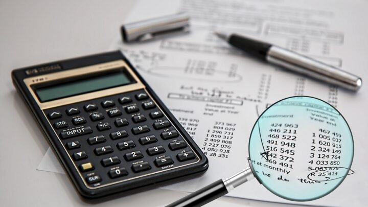 A magnifying glass held over a business audit document, symbolising a close independent review of SEO work